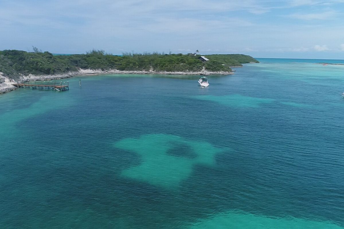 Aerial view of a Bahamian cay surrounded by shallow turquoise water