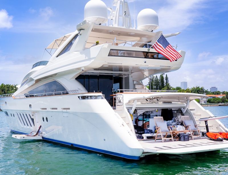 Stern quarter view of the 100 Dominator showing her aft deck and flybridge