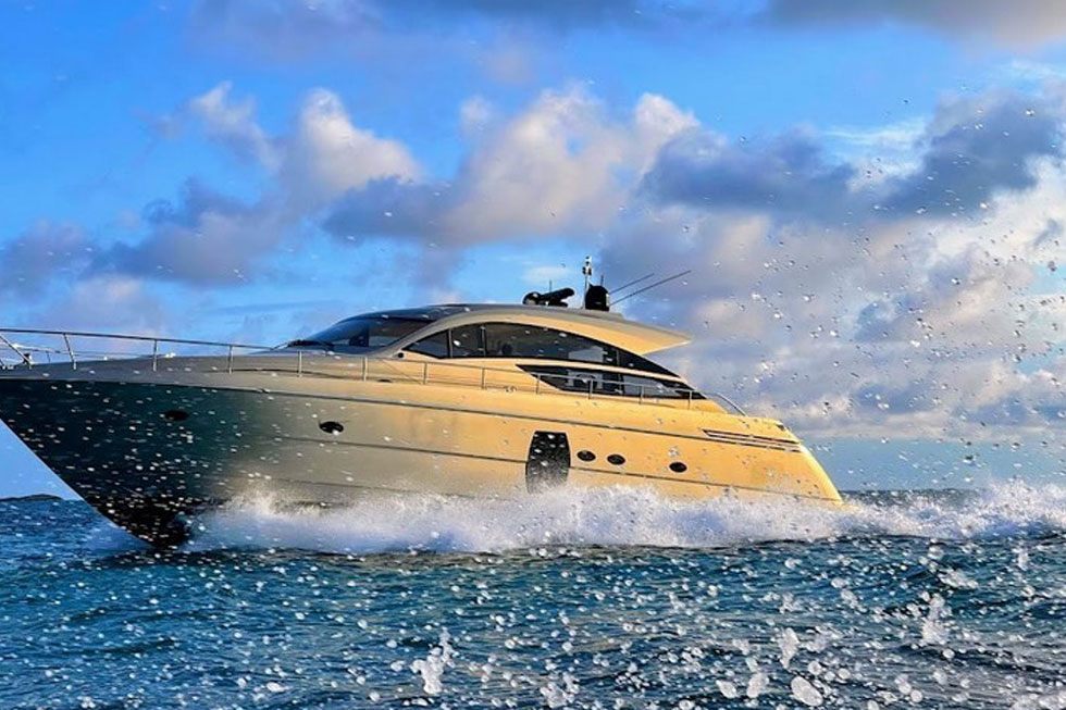 The 64 Pershing motor yacht at speed throwing spray
