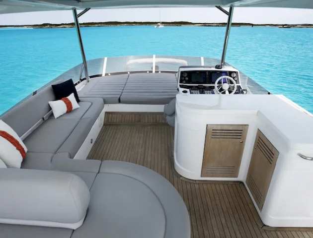 Flybridge helm and seating of the 68 Sunseeker Manhattan beneath her bimini shade